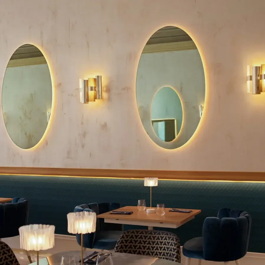Distinguished Slamp La Lollo wall lamp with circular form crafted in Lentiflex® and Opalflex® with gold-toned metallic bracket and subtle gradient