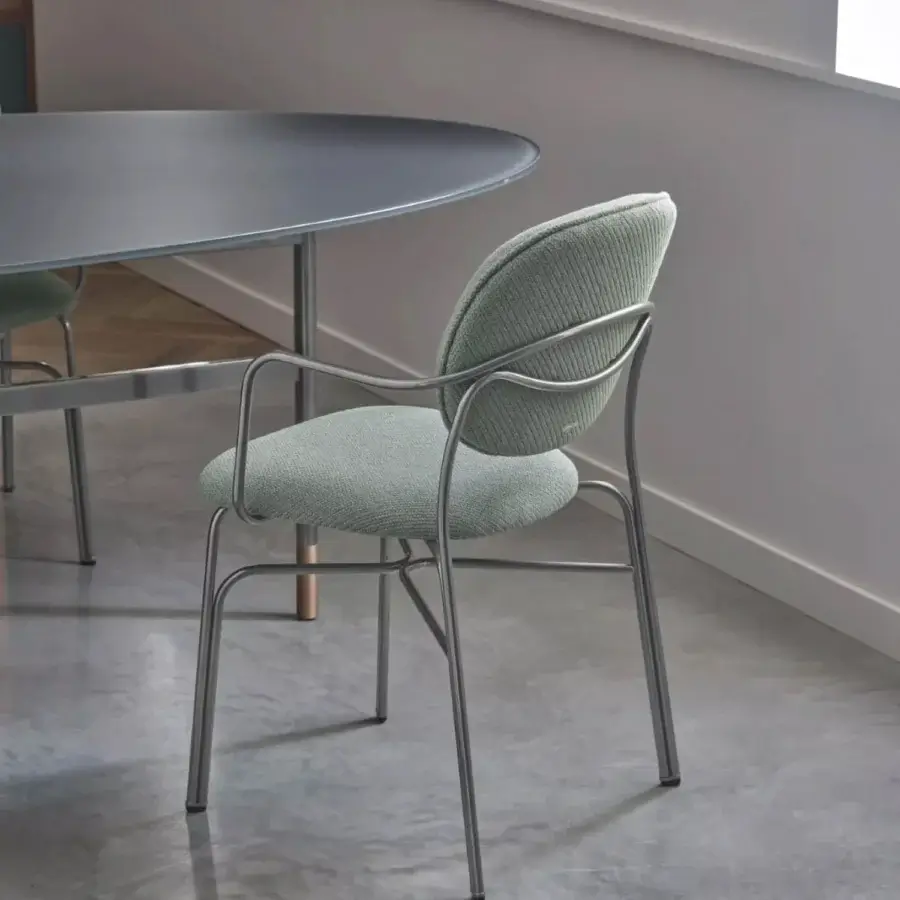 Refined Bontempi Dada chair with a sleek metal frame and soft textured green textile upholstery crafted in Italy with a satin finish