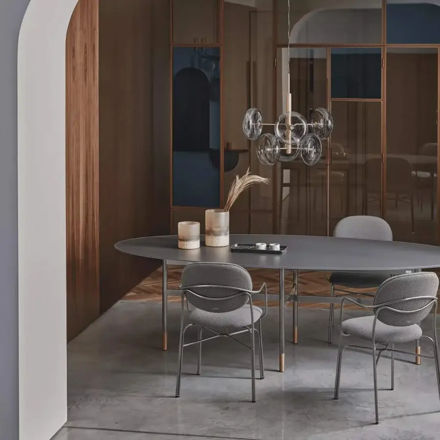 Refined Bontempi Dada chair with a dark grey metal frame and light grey textile upholstery offering ergonomic comfort
