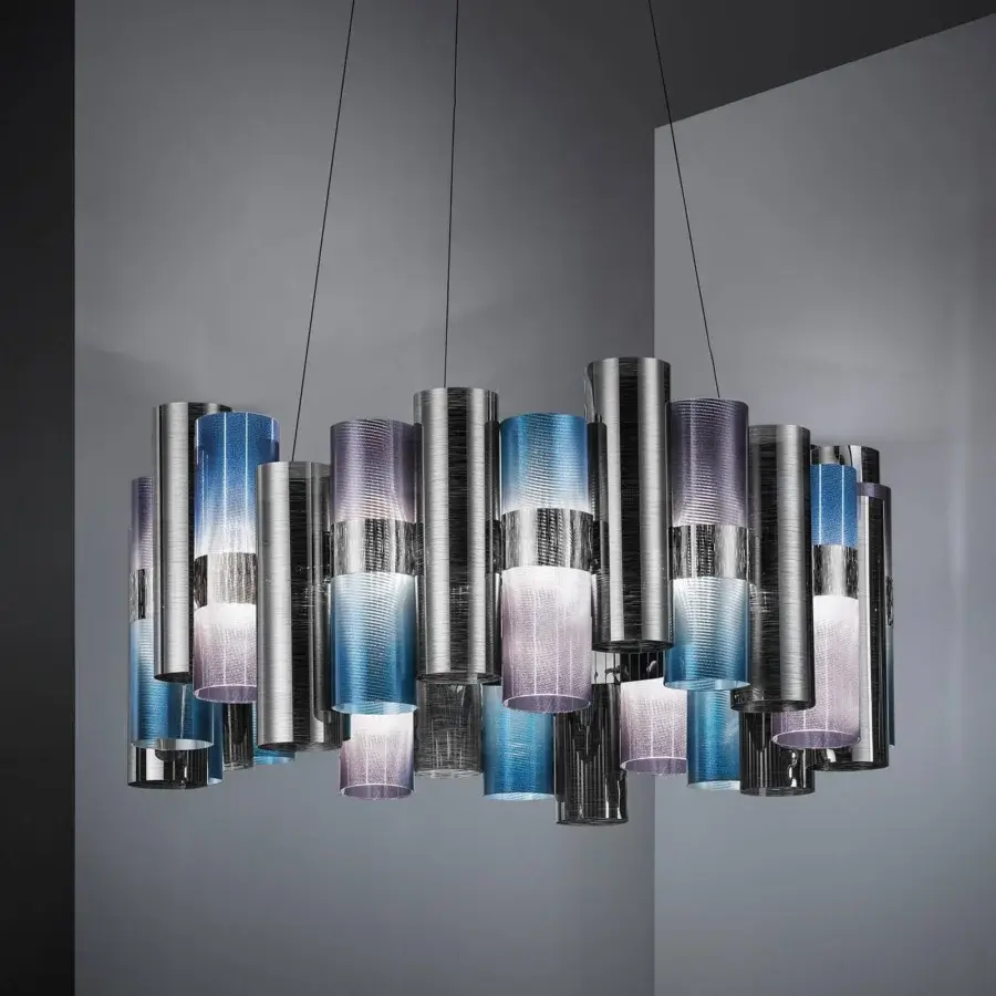 Captivating Slamp La Lollo suspension lamp built with translucent Lentiflex® cylinders in shades of blue, purple and silver with Opalflex® finish