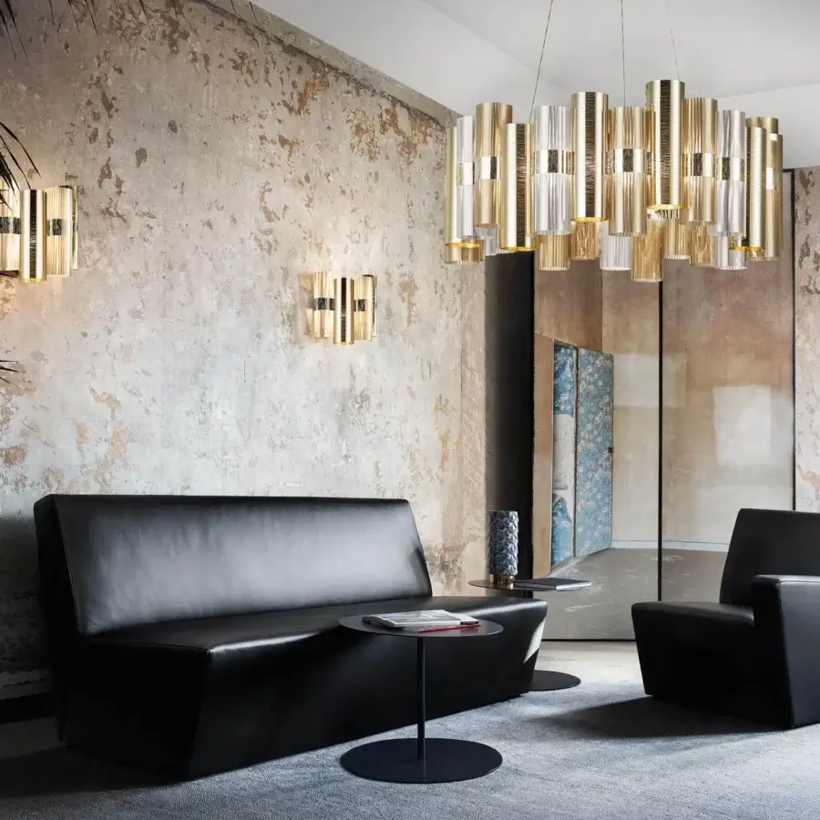 Superior Slamp La Lollo suspension lamp built with neutral white Lentiflex® cylinders and gleaming gold-toned metallic accents