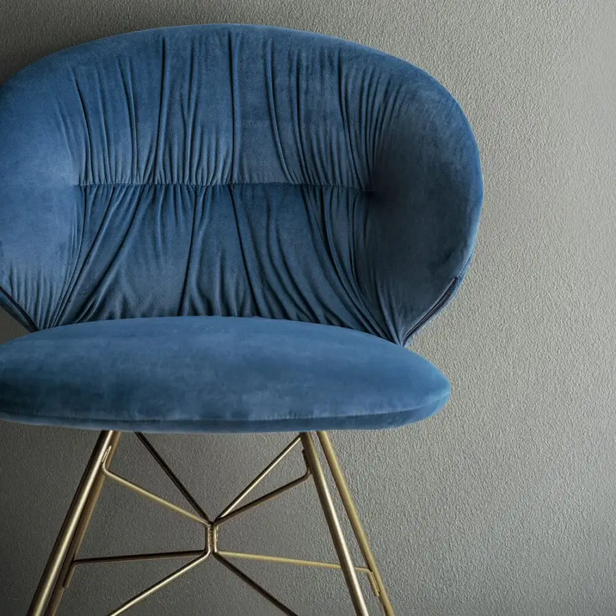 Distinctive Bontempi Drop chair with deep blue velvet textile upholstery and gold-toned metal spider base
