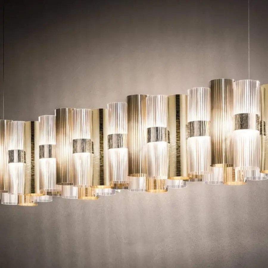 Captivating Slamp La Lollo Linear suspension lamp in technopolymer with Lentiflex® and Opalflex® finish radiating golden hues with silver accents