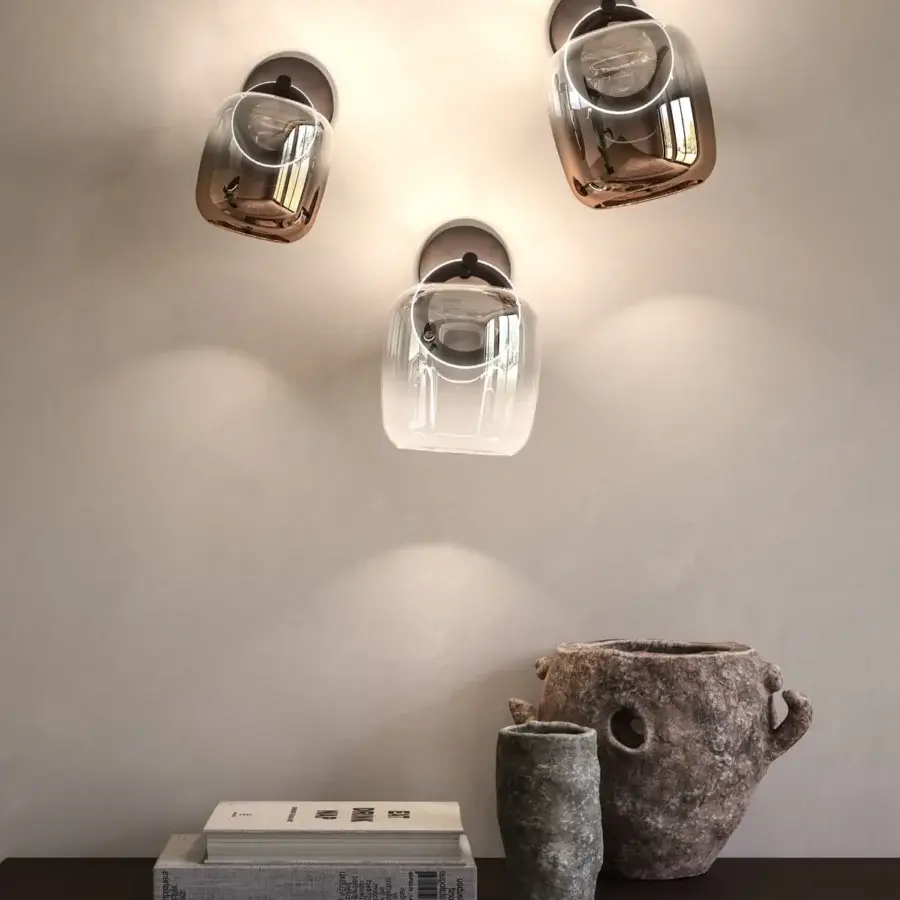 Elegant Ozzio Italia Botticelle wall lamp with refined metal structure and enveloping glass lampshade in reddish-brown finish
