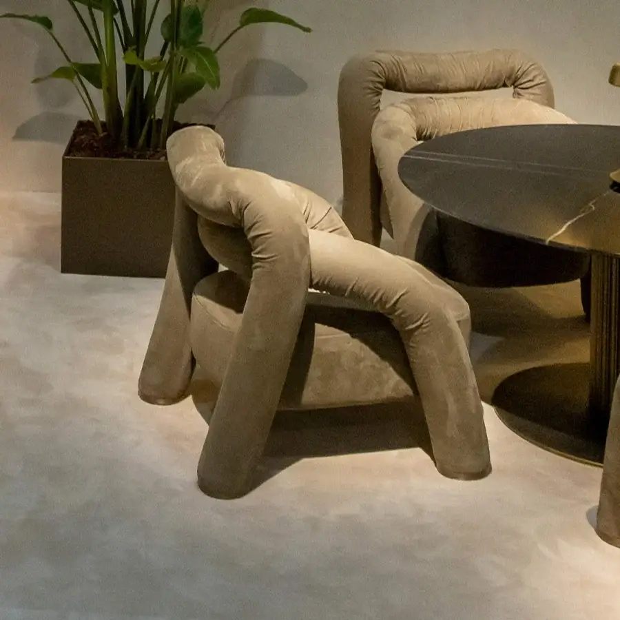 Exceptional Rugiano Abbraccio lounge chair upholstered in textured beige fabric with bronzed brass details