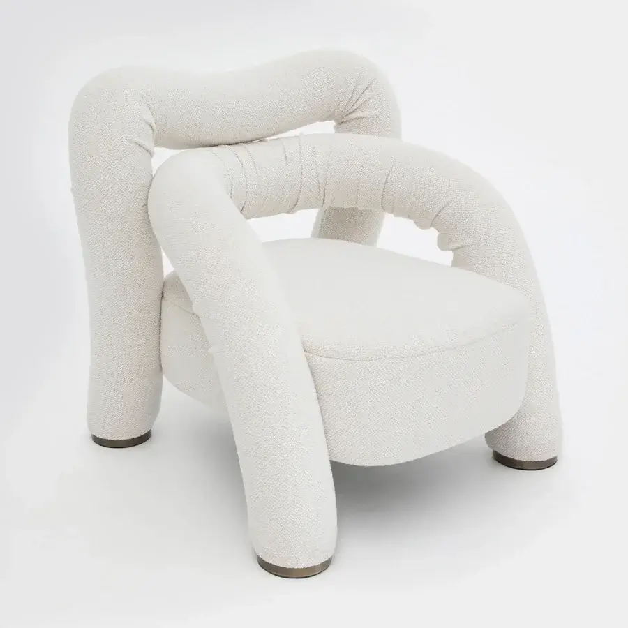 Superior Rugiano Abbraccio lounge chair upholstered in textured off-white fabric with bronzed brass details and matte finish