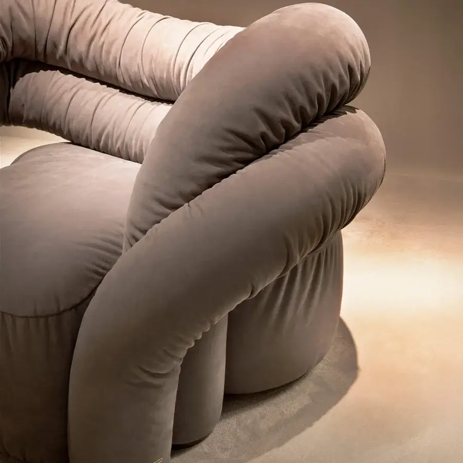 Exceptional Rugiano Abbraccio lounge chair upholstered in warm muted taupe fabric with bronzed brass details and matte finish