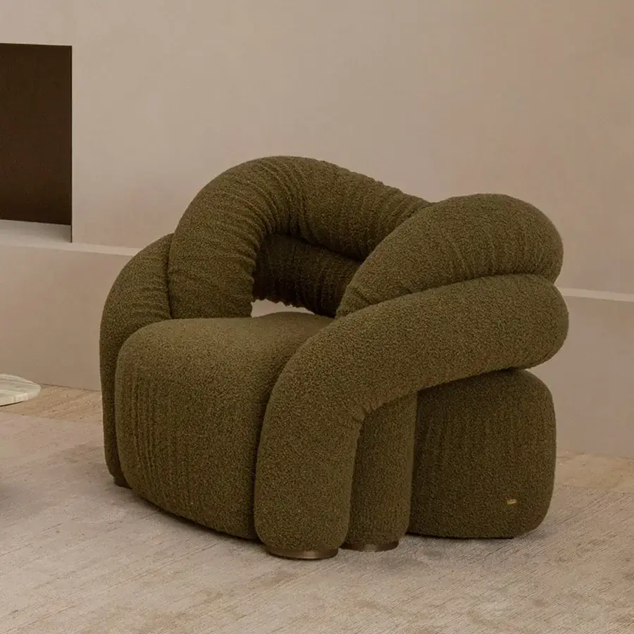 Exceptional Rugiano Abbraccio lounge chair upholstered in textured olive green fabric with bronzed brass details and matte finish