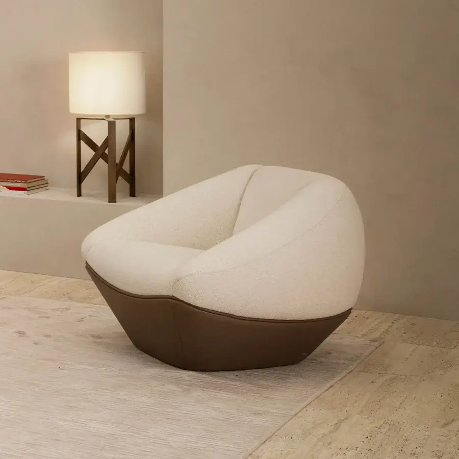 Exceptional Rugiano Iside lounge chair with uniquely faceted silhouette upholstered in textured creamy boucle fabric with dark brown leather base