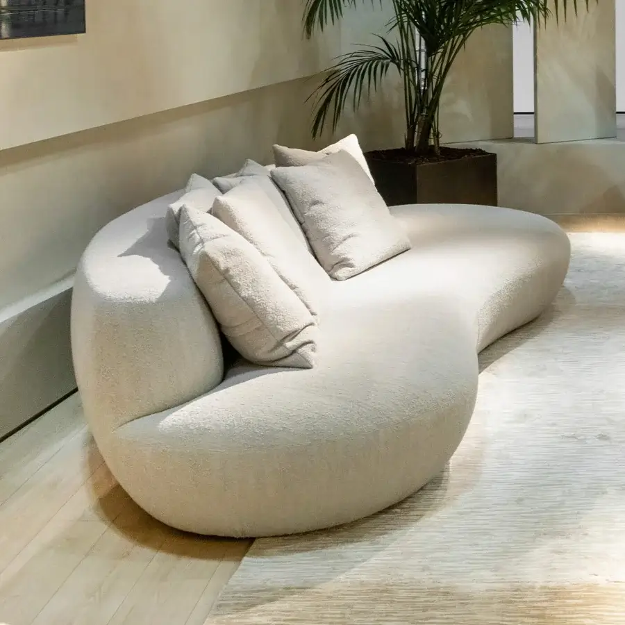 Distinguished Rugiano Rafael sofa with curved organic form and creamy beige bouclé upholstery built with a marble top