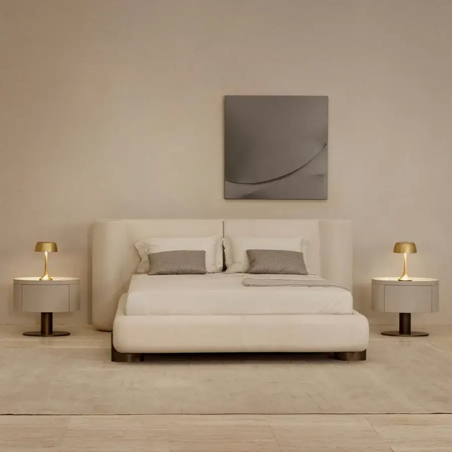 Superior Rugiano Anais bed with a rounded headboard and plush frame upholstered in neutral beige fabric with bronzed brass details