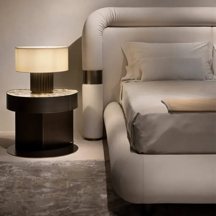 Exceptional Rugiano Loom bed with a continuously curved headboard upholstered in premium beige fabric with Bronzed Brass details