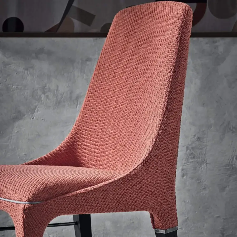 Superior Bontempi Kelly chair with muted coral pink knitted textile and sleek dark metal legs with matte finish