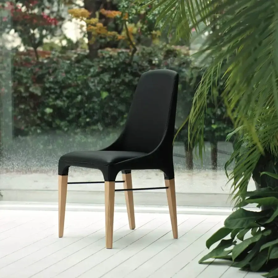 Distinguished Bontempi Kelly chair with sleek black matte synthetic seat and backrest with satin finished wood legs