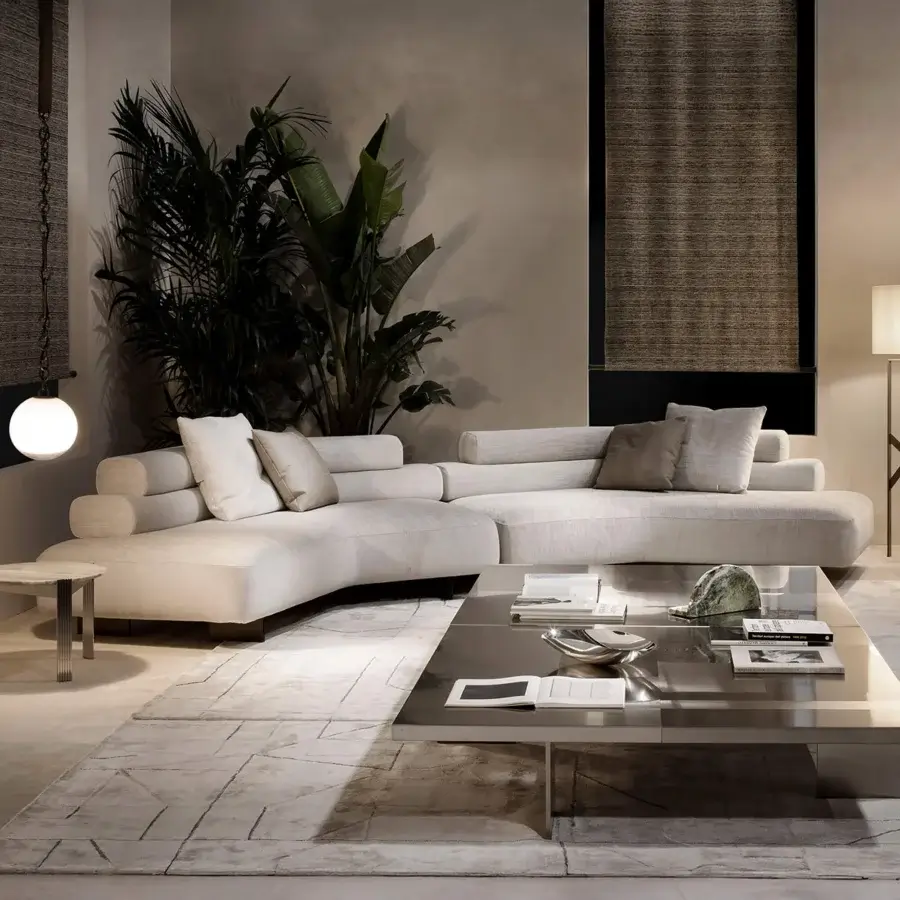 Lavish Rugiano Bali sectional with organically curved form upholstered in neutral beige textile and bronzed brass accents