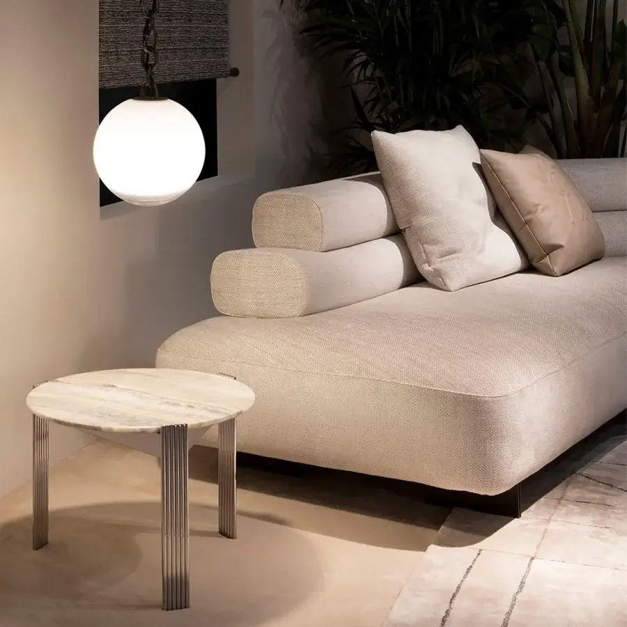 Distinguished Rugiano Bali sectional with plush cylindrical cushions upholstered in light beige textured fabric and bronzed brass details