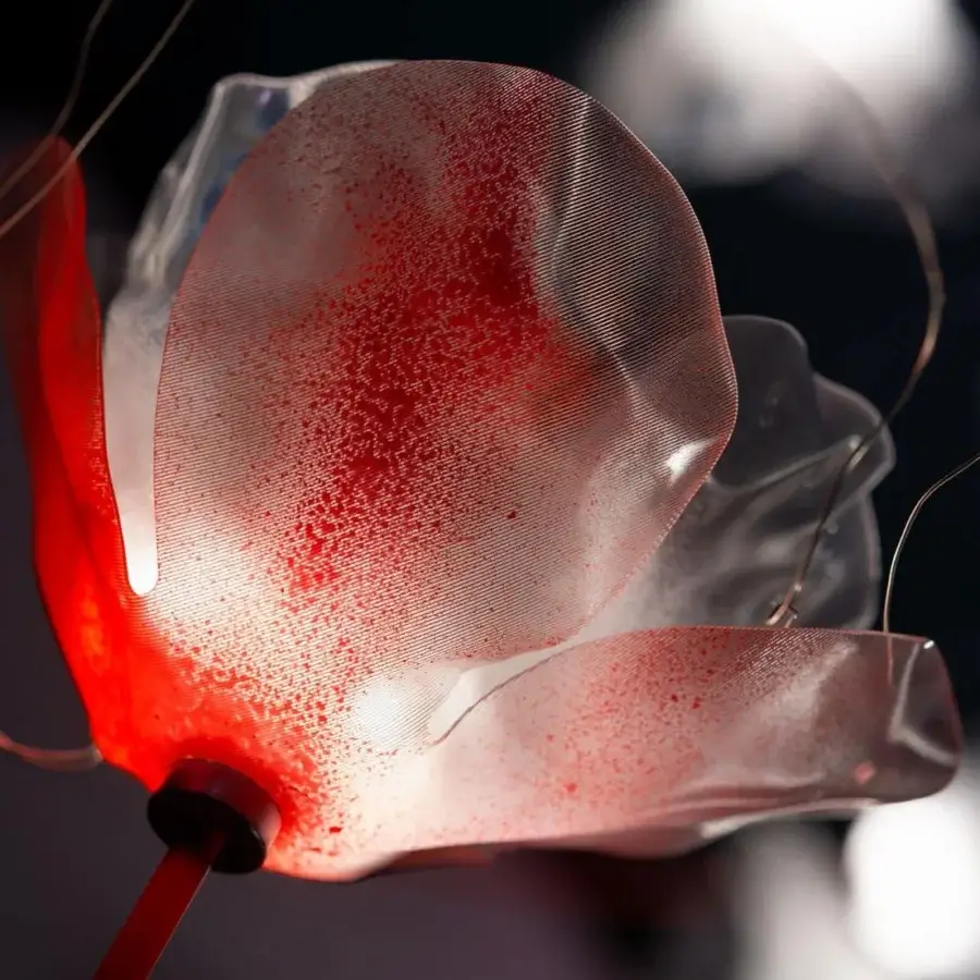 Distinguished Slamp Poppy suspension lamp crafted in technopolymer with red-painted brass stems and Lentiflex® for a translucent glow