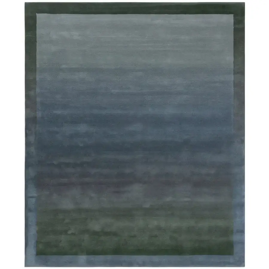 Distinguished Amini Trasparenze rug hand-tufted with New Zealand wool in gradient blues and grays with a carved, washed pile