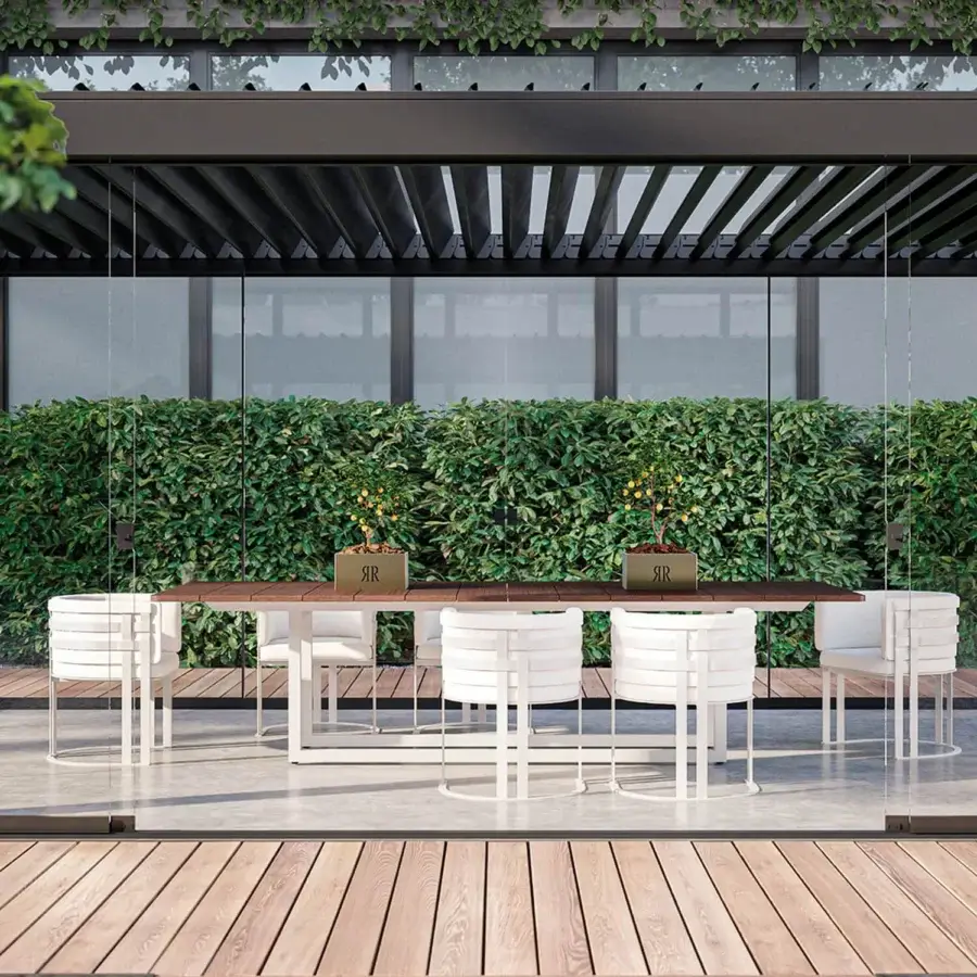 Elegant Rugiano Mirage table crafted with warm Mogano Tinto wood and a durable Outdoor Bronze Steel base with white legs