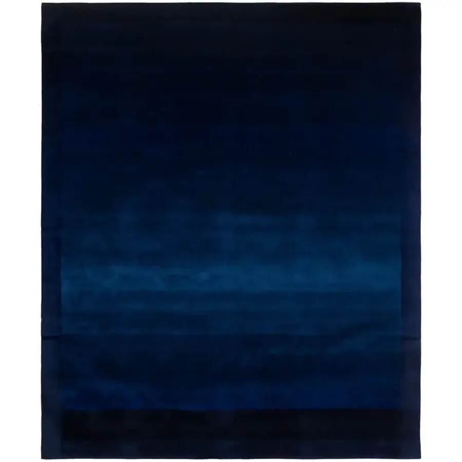 Distinguished Amini Trasparenze rug hand-tufted with a gradient of blues in New Zealand wool and carved pile finish