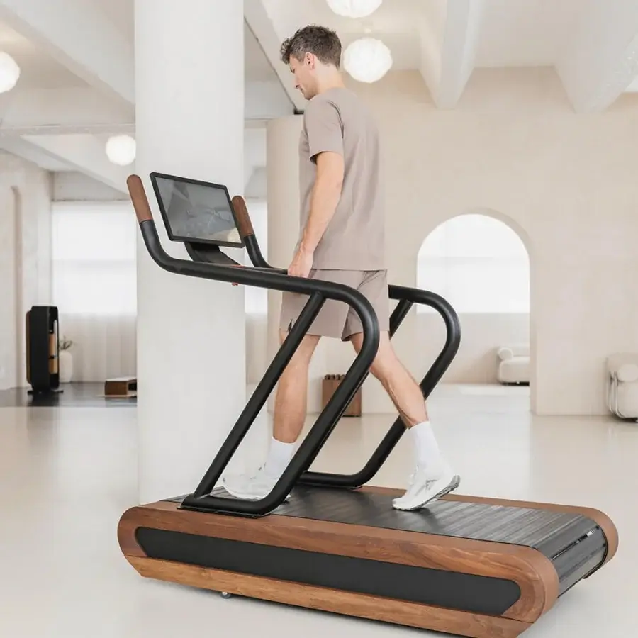 Elegant WATERROWER Citius treadmill crafted from fine woods with satin finish and matte black metal framing delivers a remarkably natural running experience