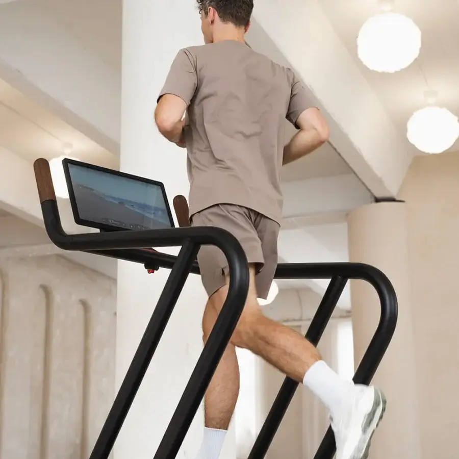 Exceptional NOHRD Citius treadmill crafted from dark brown wood and precision-engineered metal with a satin finish