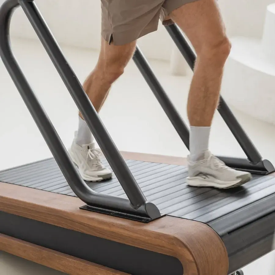 Exceptional NOHRD Citius treadmill crafted from fine woods and precision-engineered metal with a warm brown satin finish