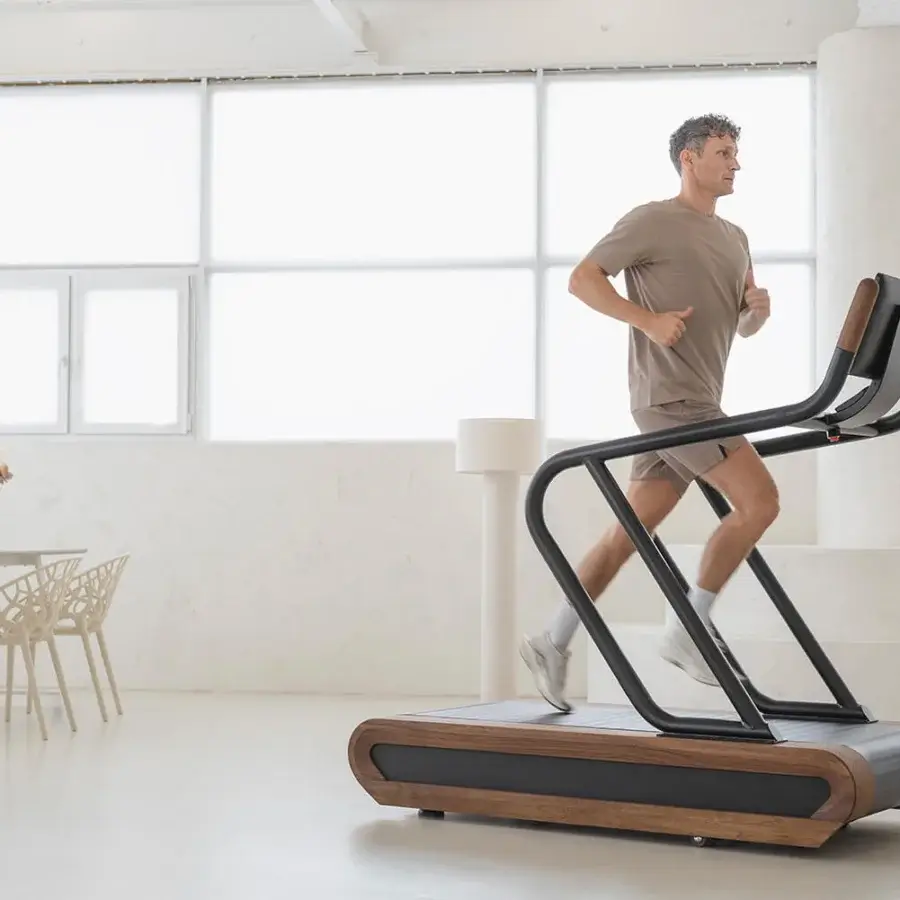 Exceptional NOHRD Citius treadmill built with dark wood and precision metal components in a matte black finish