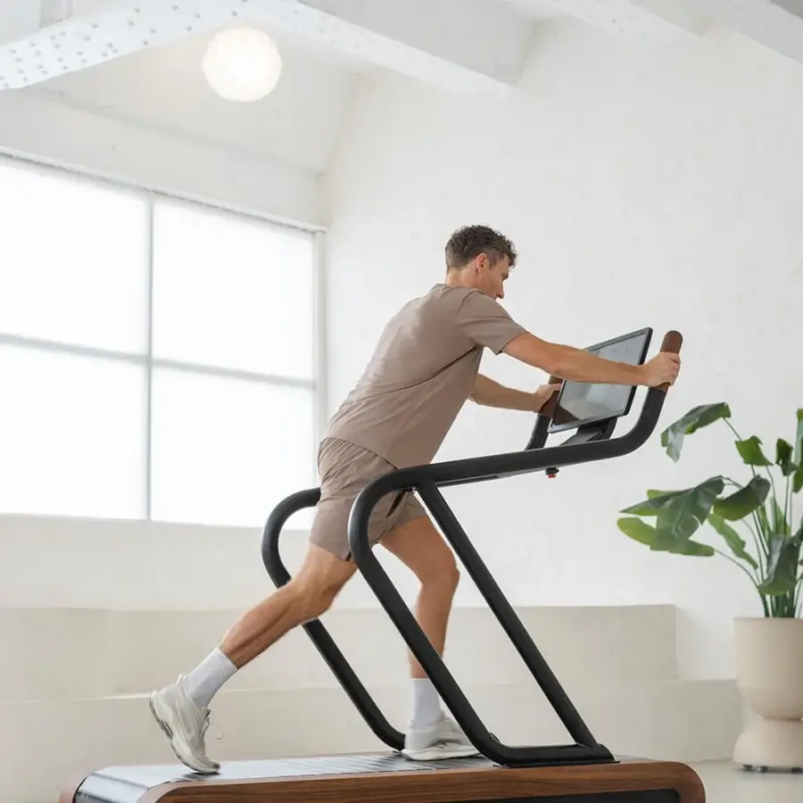 Distinguished NOHRD Citius treadmill crafted with warm brown woods and dark metal in a satin finish