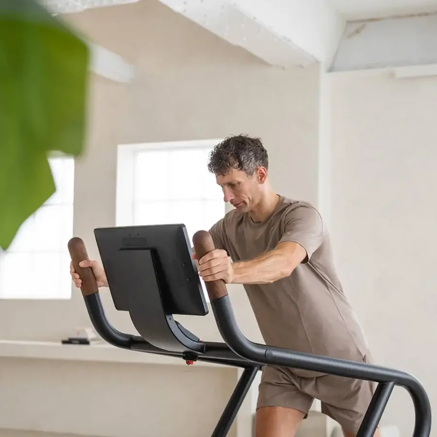 Exceptional NOHRD Citius treadmill crafted with fine woods and precision-engineered metal in a matte black finish