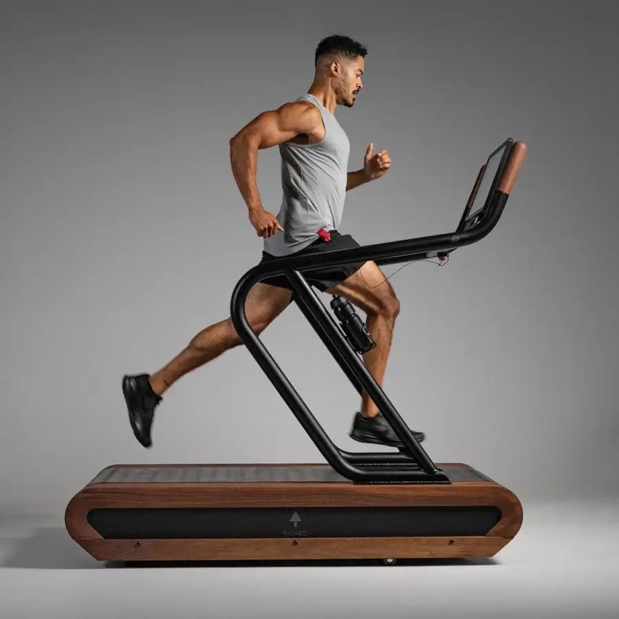 Elegant WATERROWER Citius treadmill built with fine woods and precision-engineered metal in a matte black finish