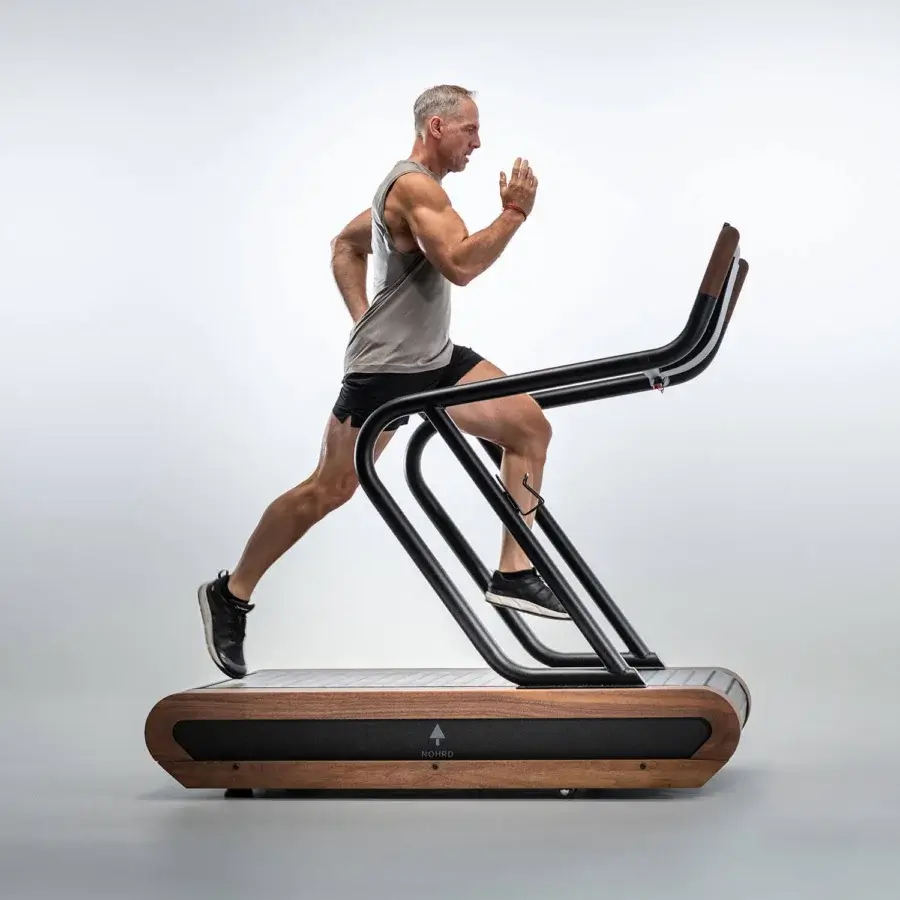 Elegant NOHRD Citius treadmill built with warm brown wood and precision-engineered metal in a matte black finish
