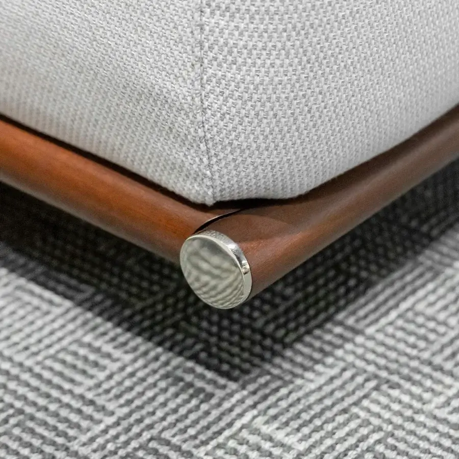 Distinguished Rugiano Amalfi sofa with light gray woven outdoor fabric and warm stained mahogany with crisp chrome details