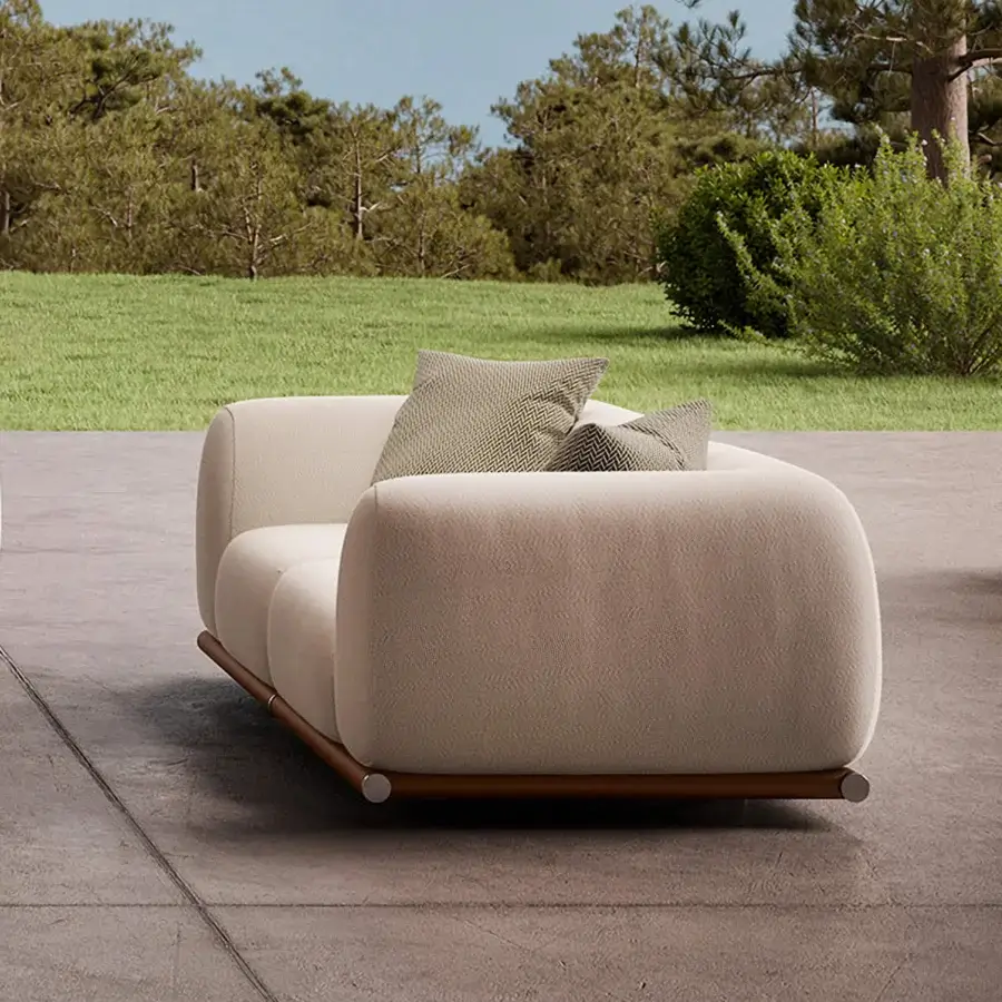 Distinguished Rugiano Amalfi sofa with warm stained mahogany, crisp chrome, and light beige outdoor fabric upholstery