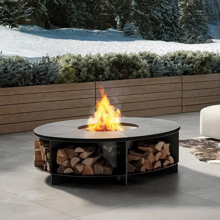 Exceptional Rugiano fireplace crafted with black-painted metal and stone materiality exhibiting a functional core with integrated wood storage