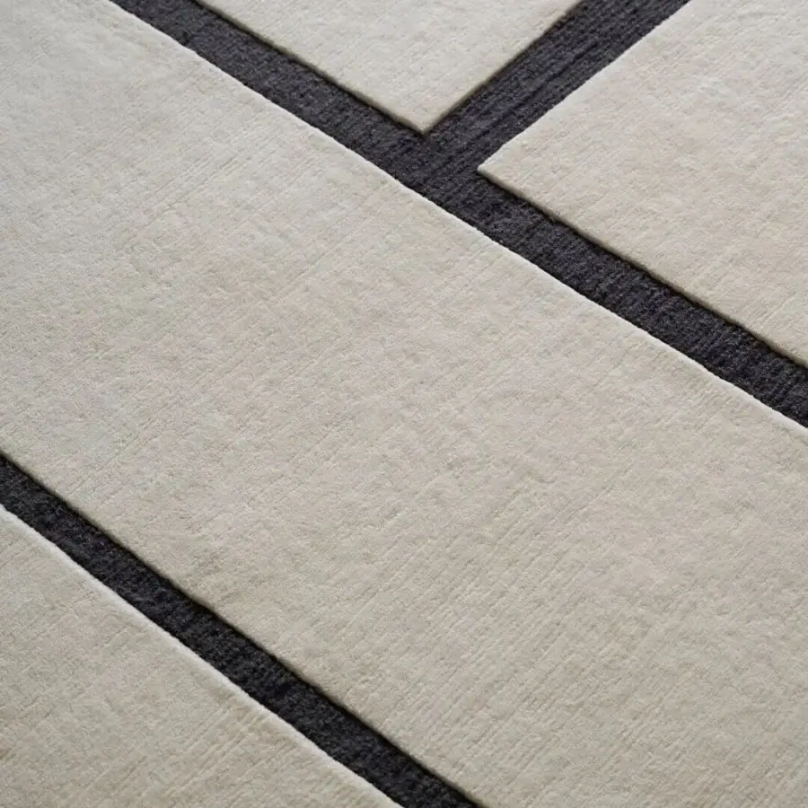Distinguished Amini Campiture rug hand-knotted in India with black lines against a creamy field and a pile loop cut finish