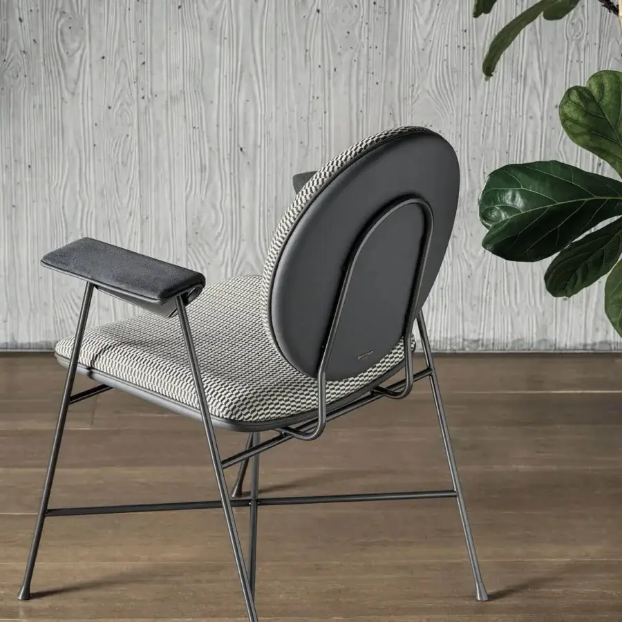 Elegant Bontempi Penelope chair with curved form, neutral beige and black geometric textile, plus satin-finish metal frame