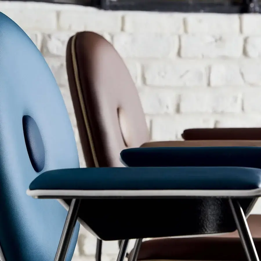 Exceptional Bontempi Penelope chair with gently curved form upholstered in textured teal synthetic fabric and dark metal legs