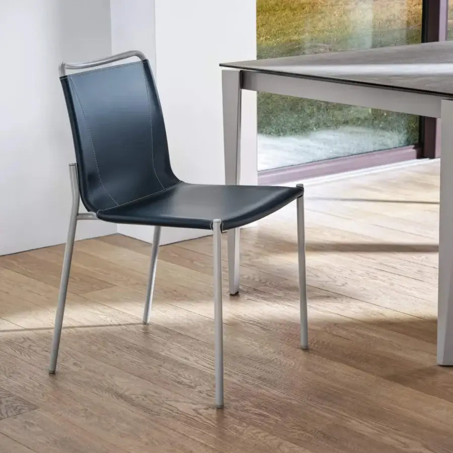 Elegant Bontempi Shape chair with curved form upholstered in dark blue-black textile and satin-finish metal frame