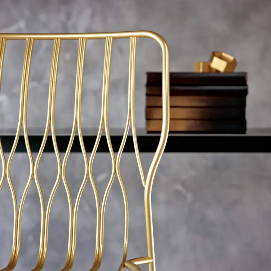 Elegant Bontempi Freak chair crafted in glossy gold tone metal with an airy, organically curved silhouette and cage-like backrest