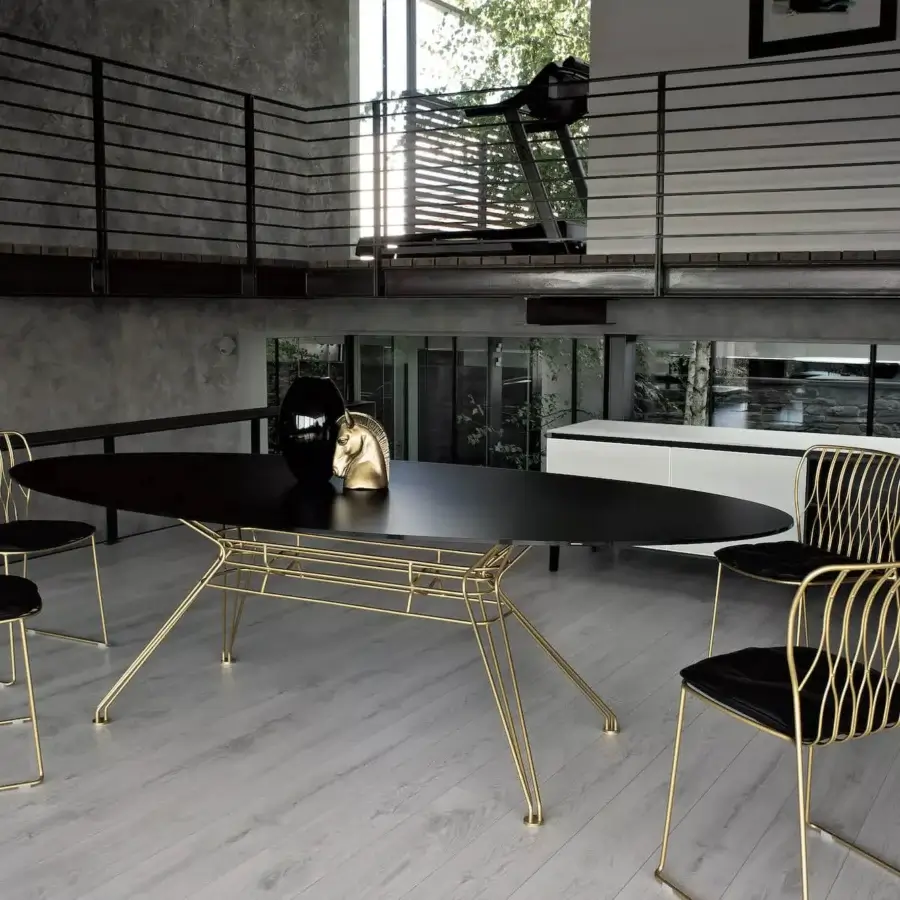 Superior Bontempi Freak chair with glossy golden metal frame and matte black textile seat presents a sculptural silhouette