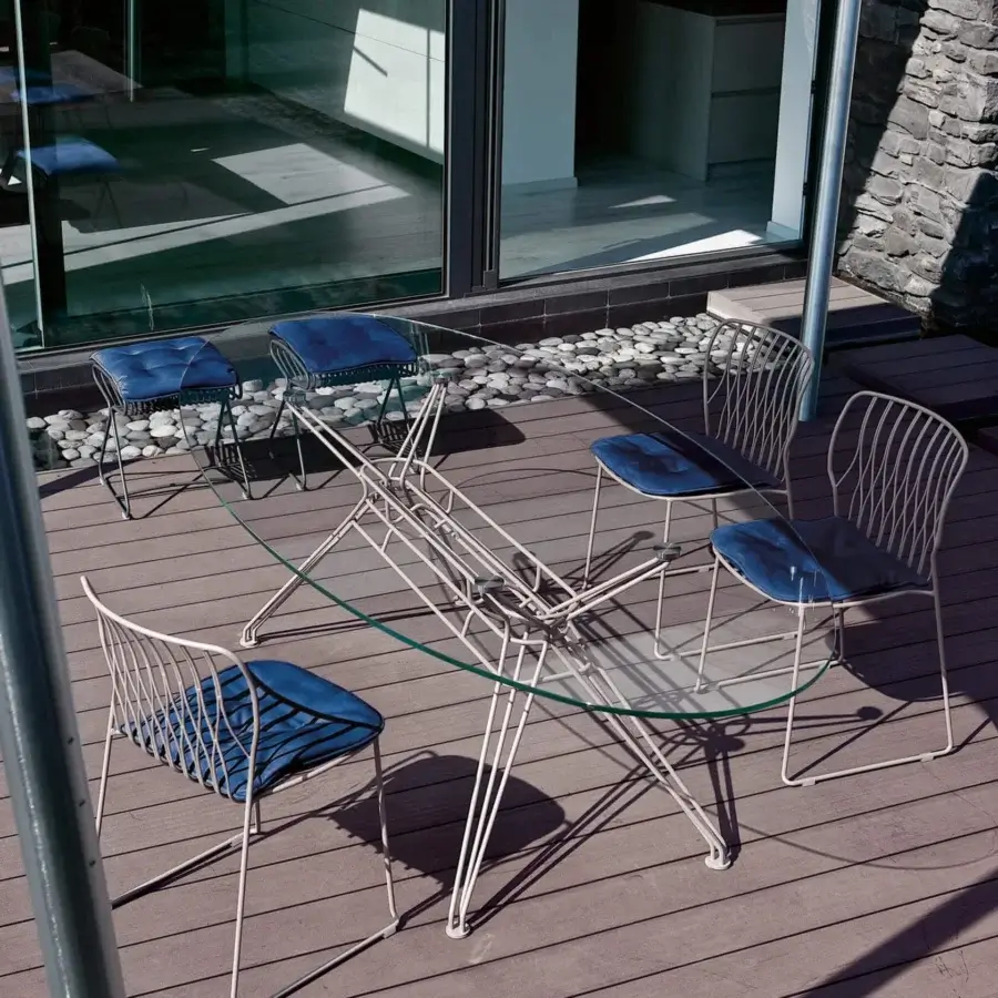Refined Bontempi Freak chair with deep blue textile and satin metal framing for sophisticated outdoor use