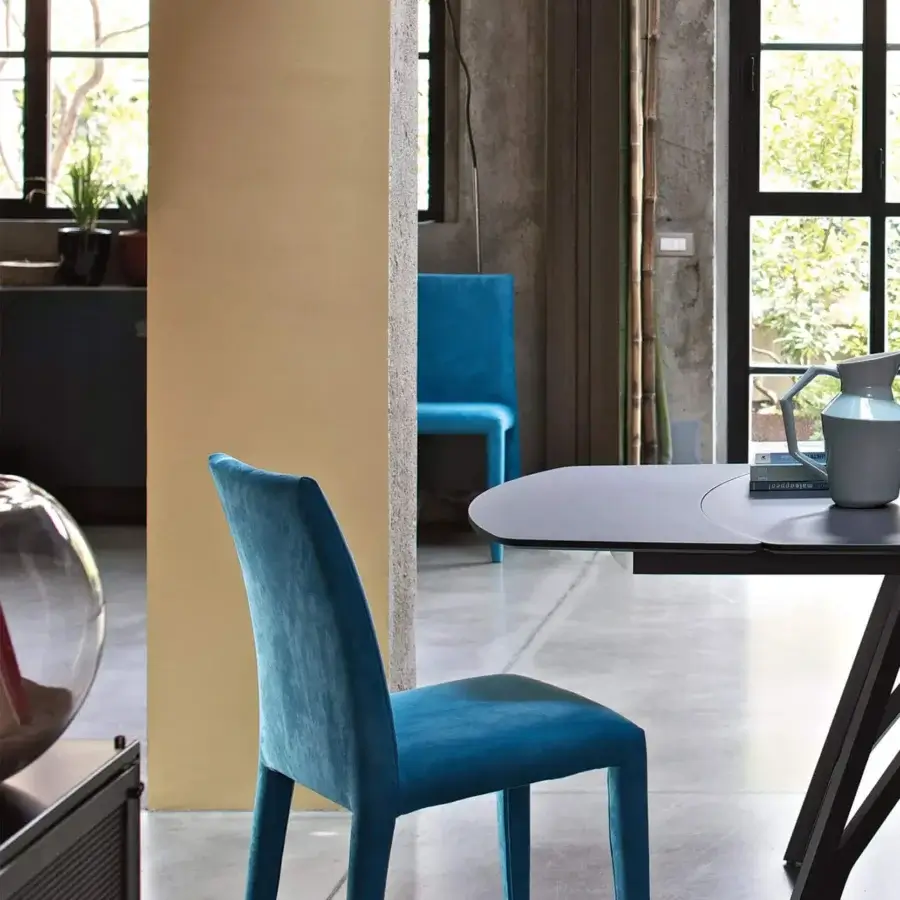 Elegant Bontempi Sofia chair with fully upholstered construction in teal blue velvet-like finish and flexible back