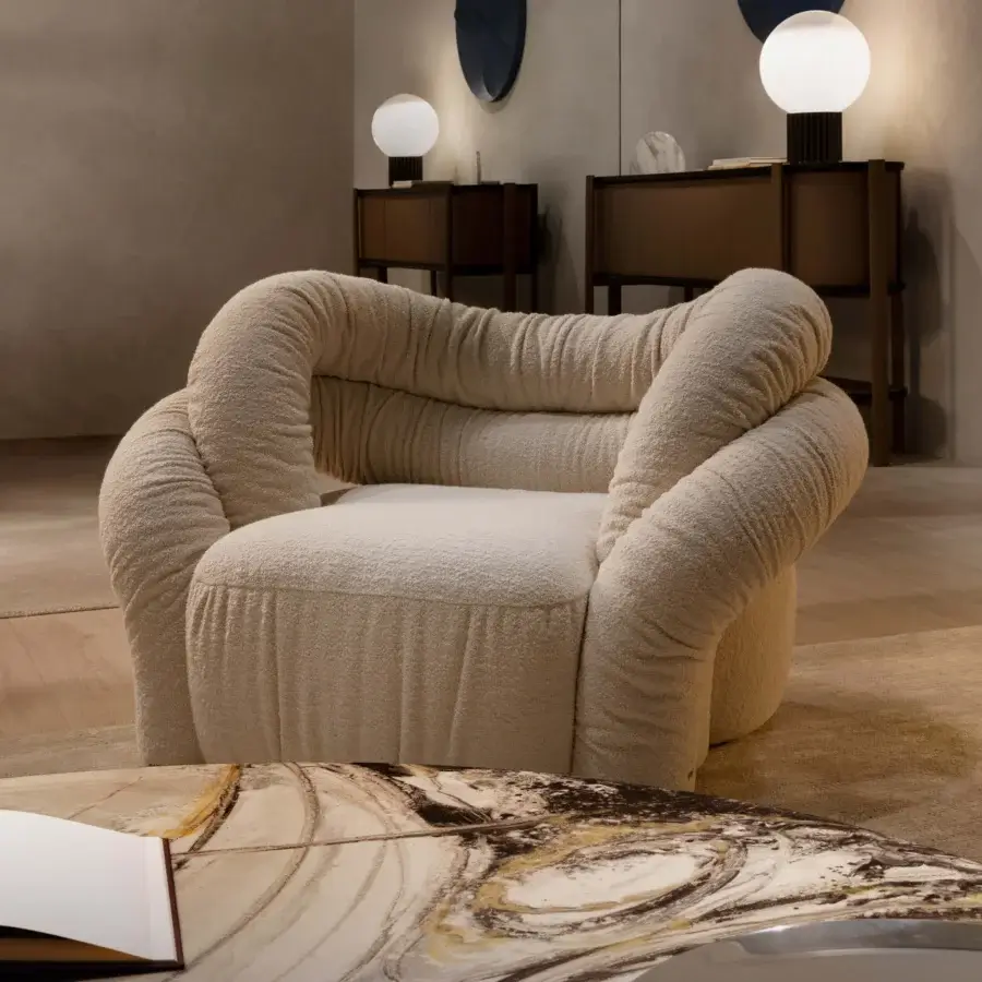 Superior Rugiano Abbraccio lounge chair with plush light beige fabric upholstery and bronzed brass details crafted in Italy