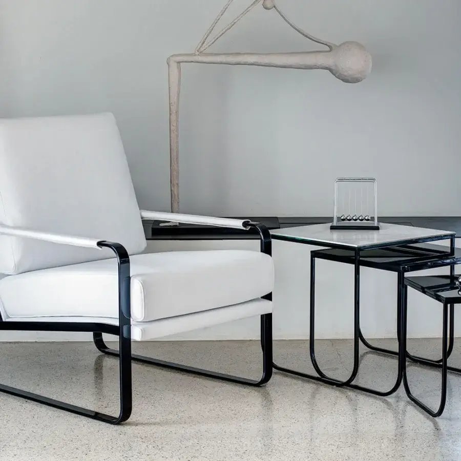 Refined Bontempi Clarissa lounge chair with smooth white textile upholstery and glossy black metal frame
