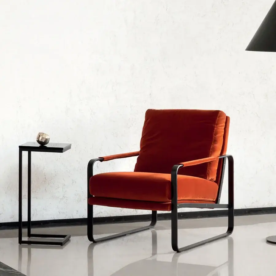 Distinctive Bontempi Clarissa lounge chair with reddish-orange textile upholstery and sleek matte black metal frame