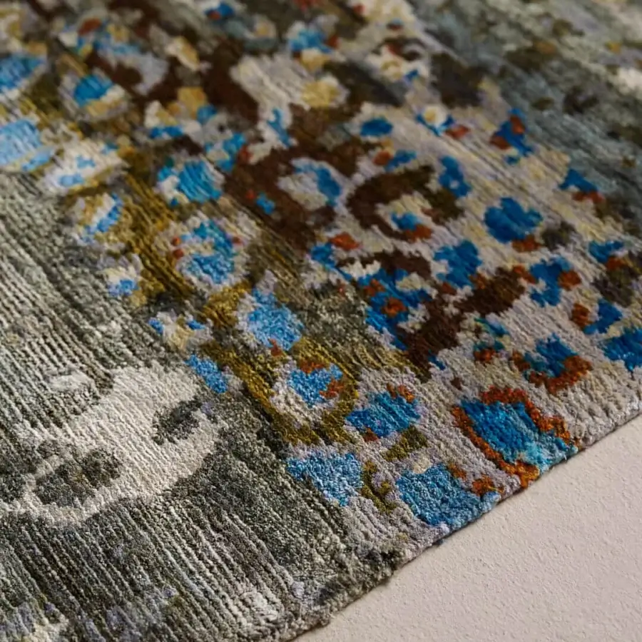 Distinguished Amini Flora rug hand-knotted from pure silk with cool blues, greens, and browns exhibiting a subtly distressed finish