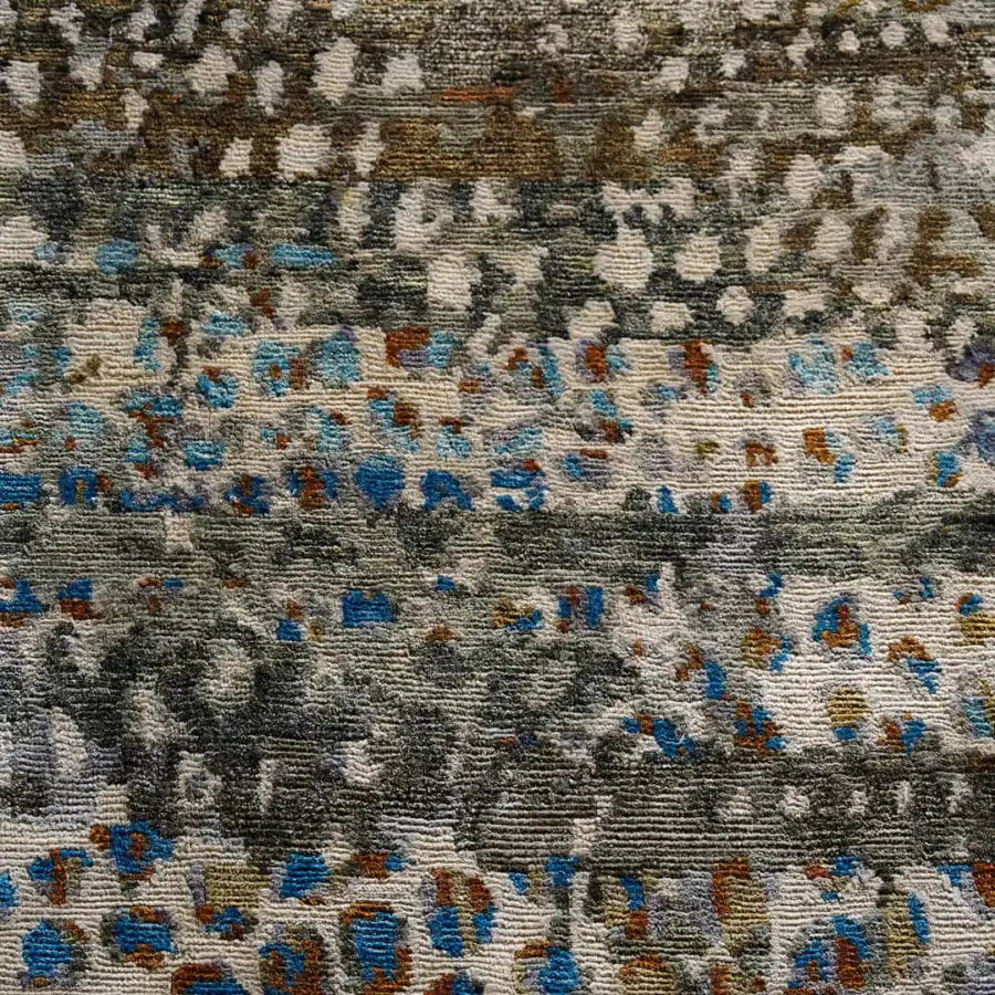 Lavish Amini Flora rug hand-knotted from pure silk with dynamic blue and earthy brown floral motifs finished with meticulous carving