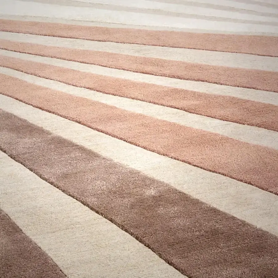 Distinguished Amini Ventaglio rug displays a dynamic fan-like pattern in blush pink, beige, and brown with wool and natural silk, hand-knotted in India