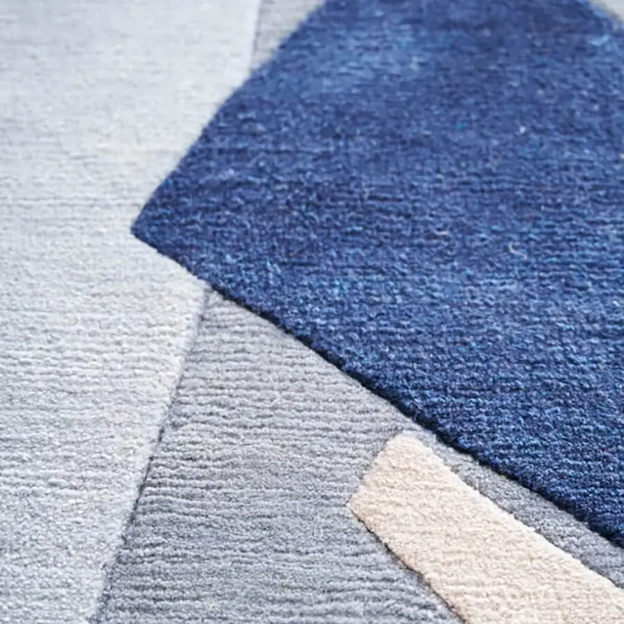 Exceptional Amini Ventaglio rug displays geometric design in captivating blue shades with wool and natural silk, finished with hand washing and carving